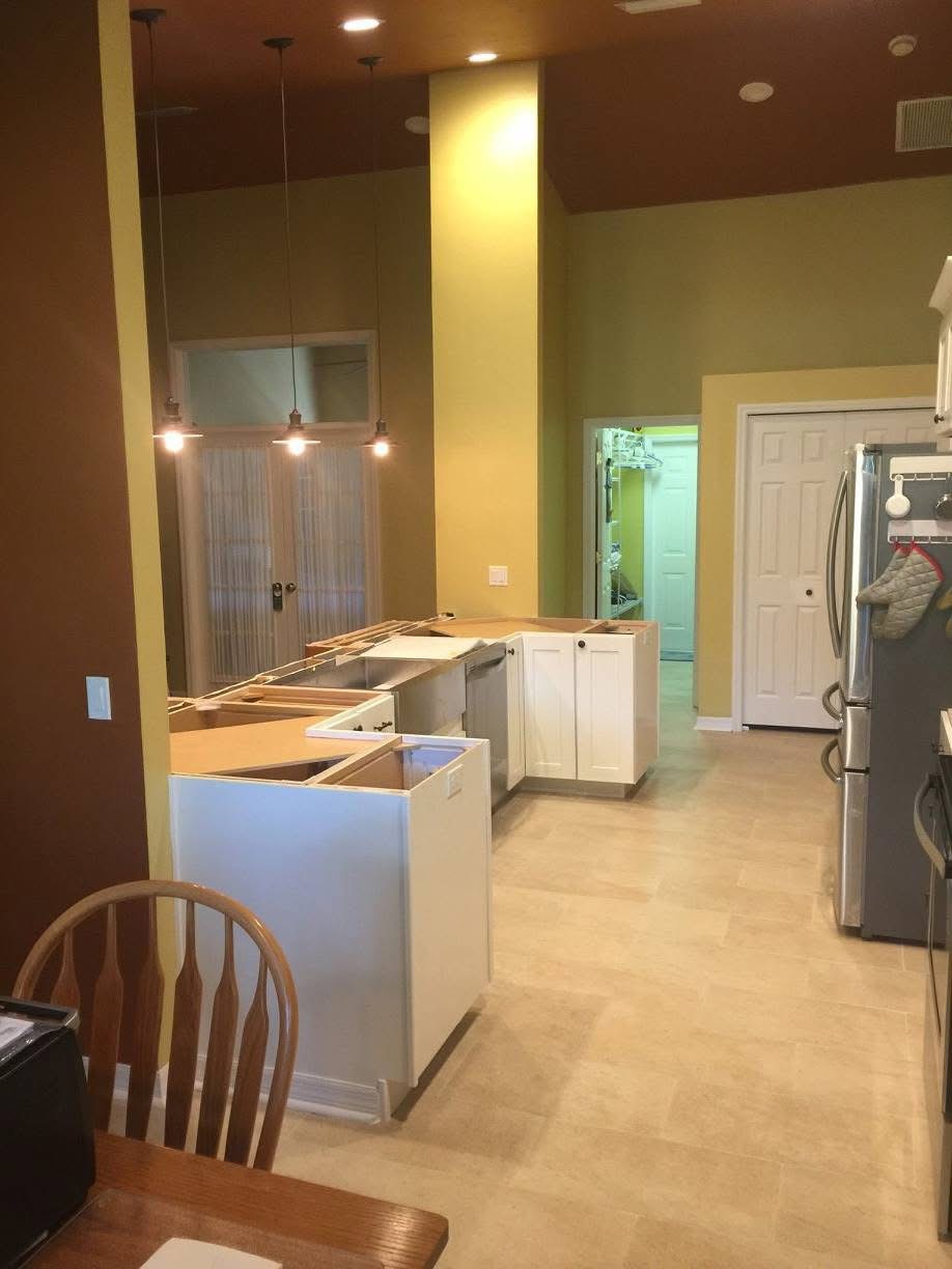 Kitchen with new shaker cabinet boxes set and open for countertop templating